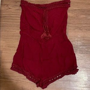 Sleeveless maroon romper with lace detailing